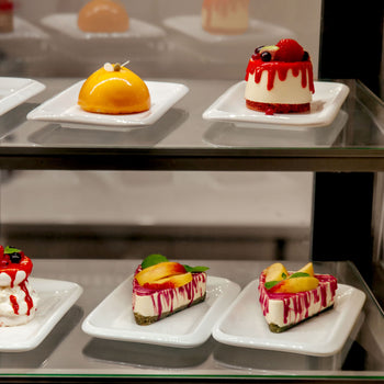 Assortment of baked bread on shelves.